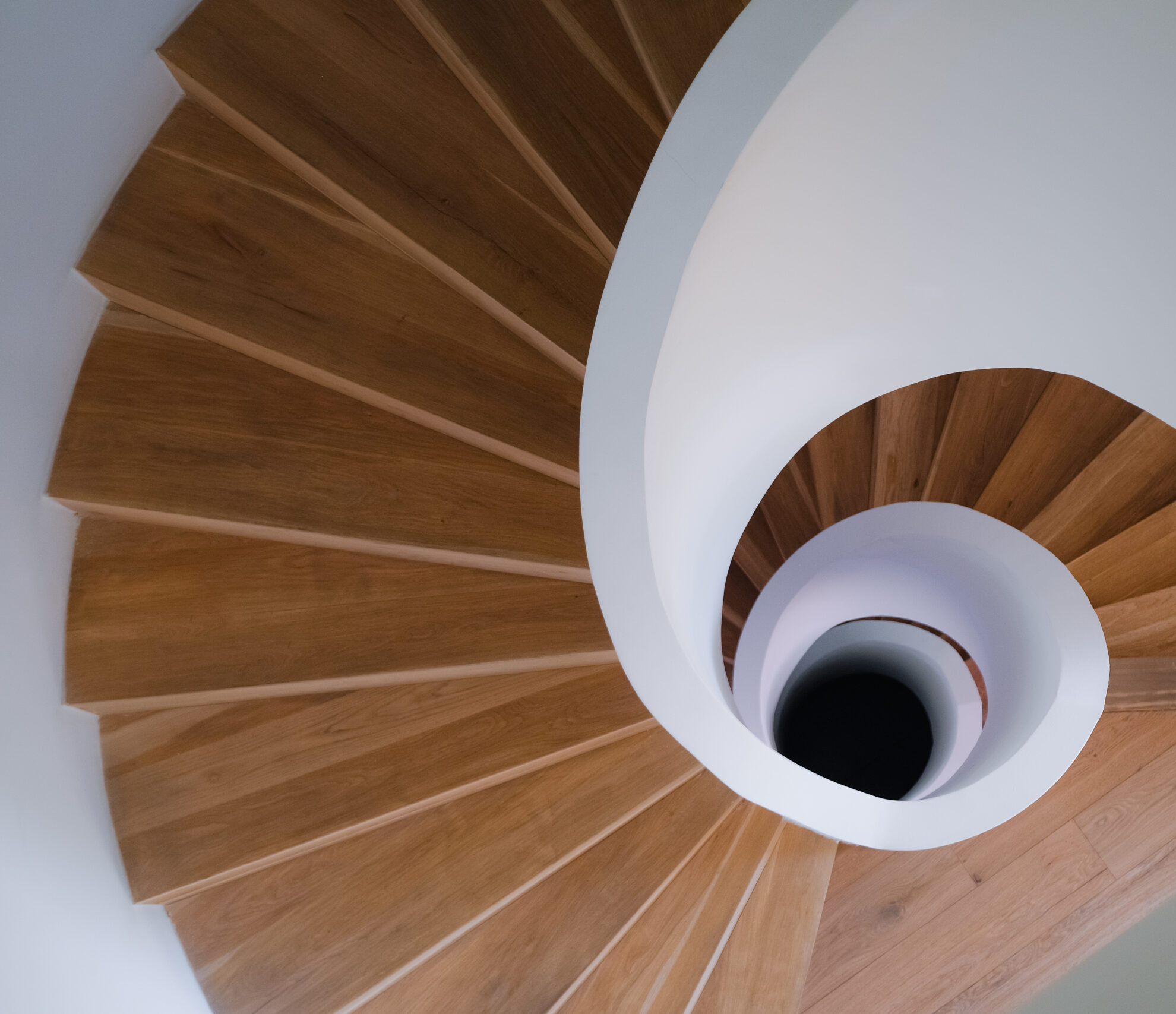 Spiral staircase showing guided movement through continuous spatial transition